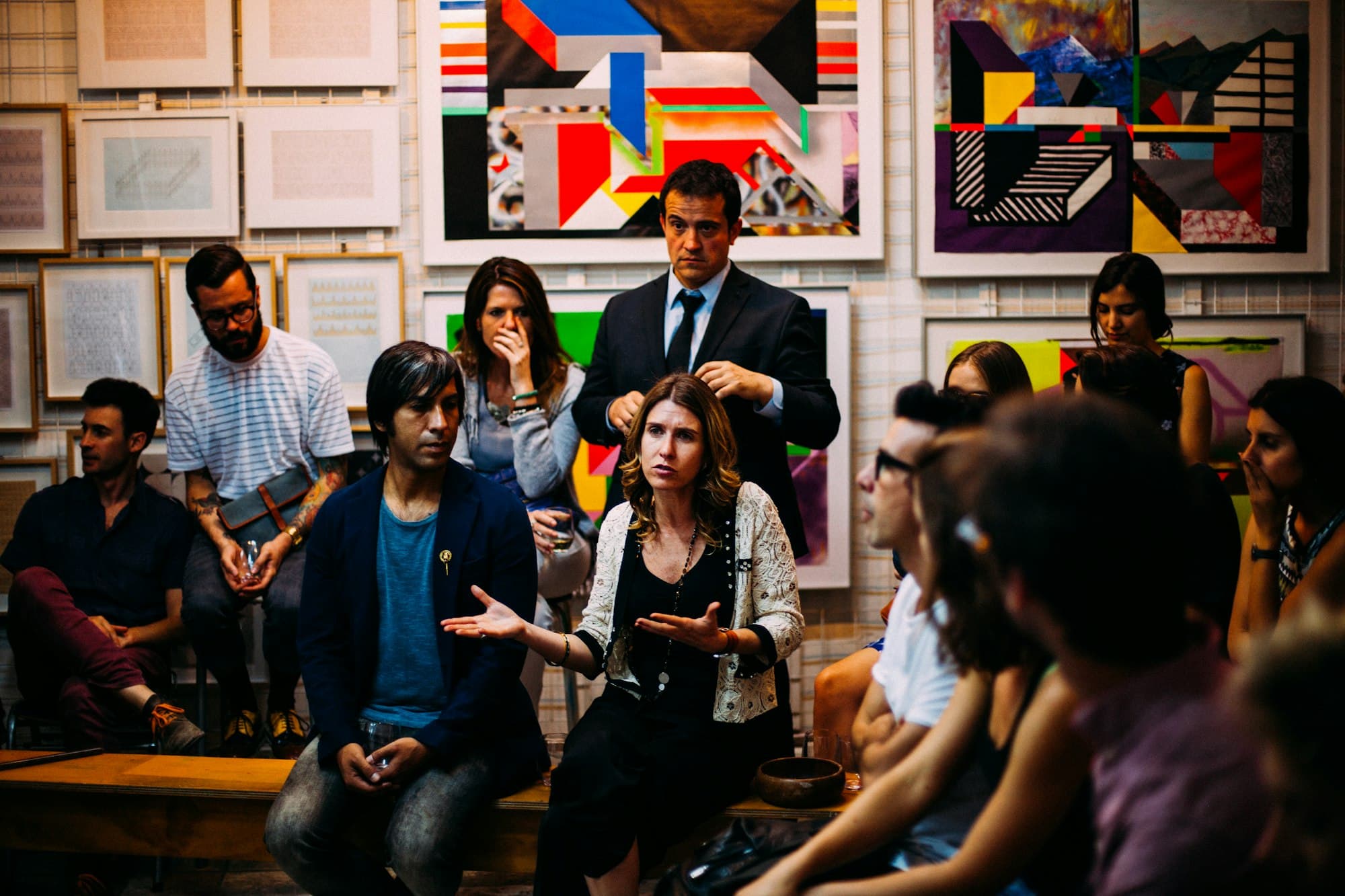 A group in a lively discussion in a bright room